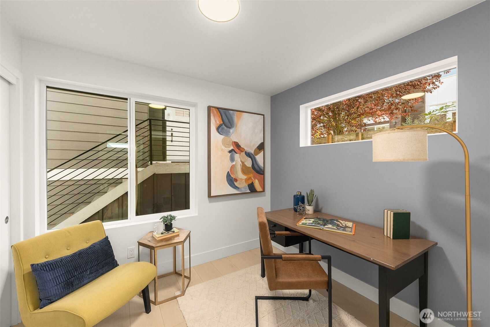 911 North 98th Street, Unit A Seattle, WA 98103 - Photo 23 of 26 a view of a workspace with furniture and a window