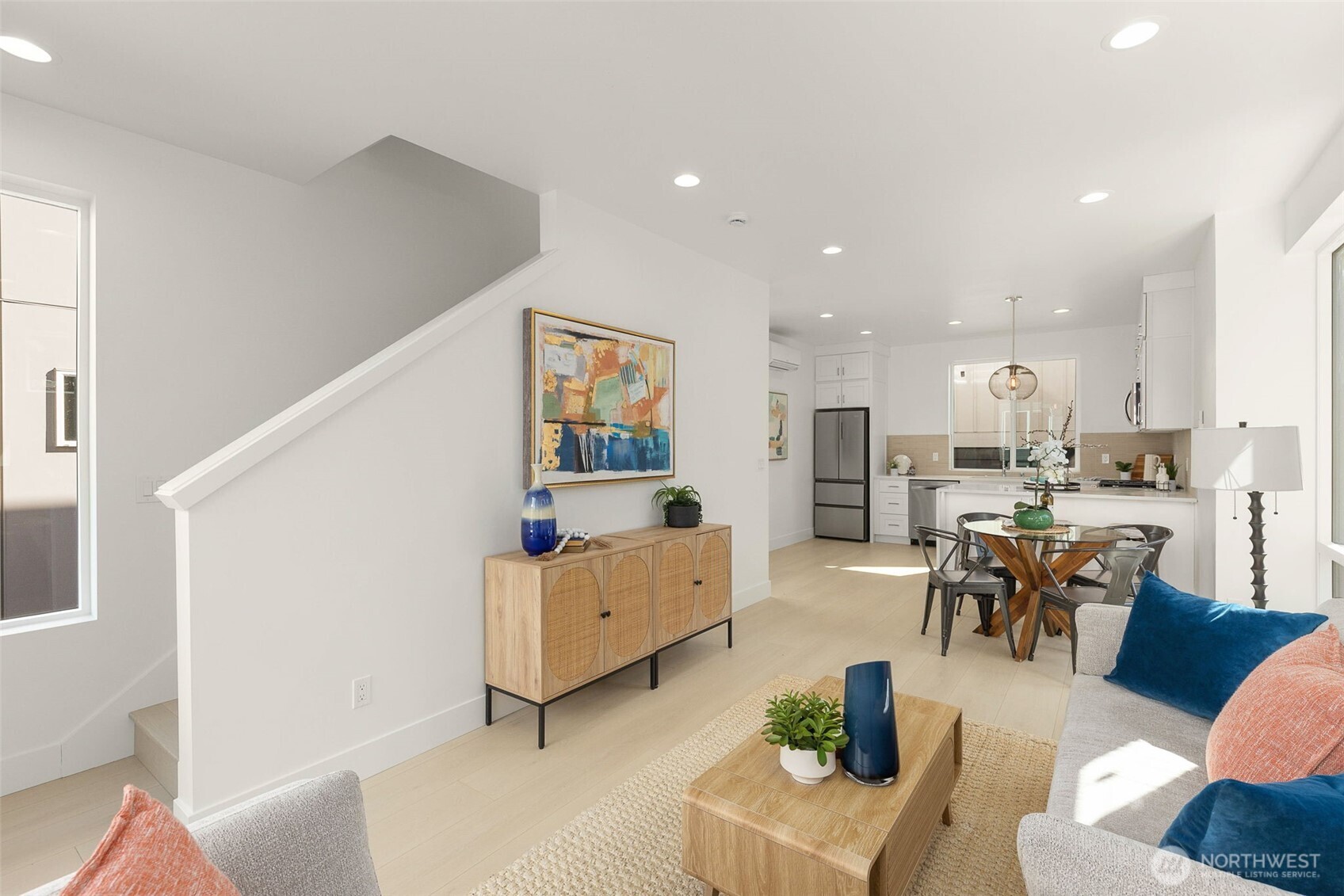 911 North 98th Street, Unit A Seattle, WA 98103 - Photo 9 of 26 a living room with furniture and kitchen view