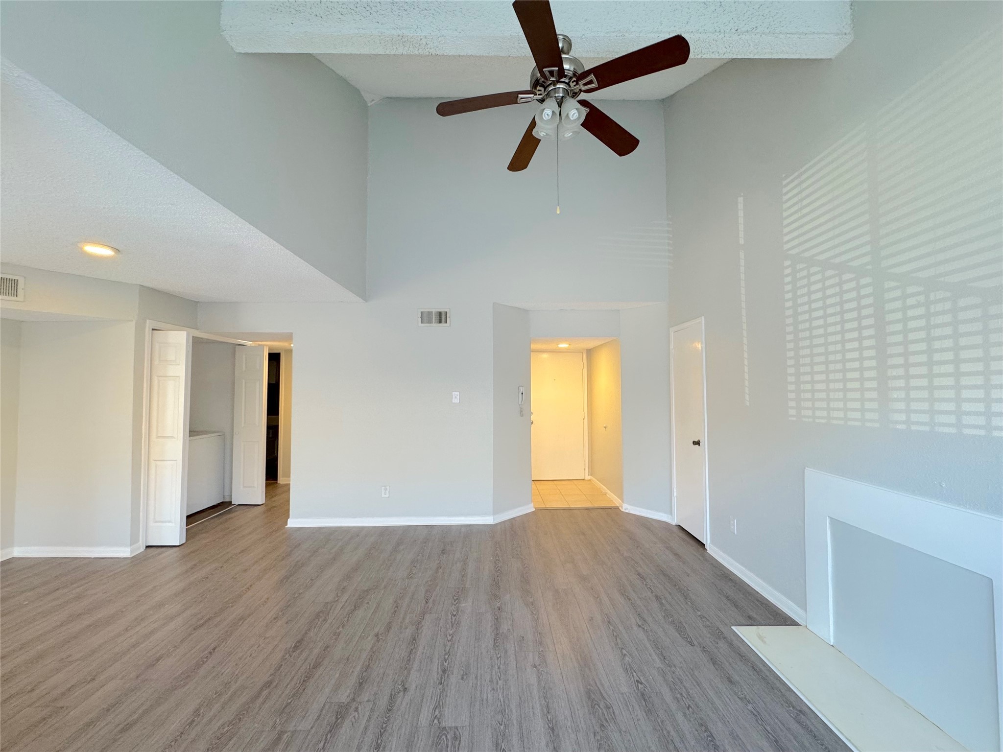 12200 Overbrook Lane, Unit 38D Houston, TX 77077 - Photo 5 of 10 wooden floor in an empty room with a window