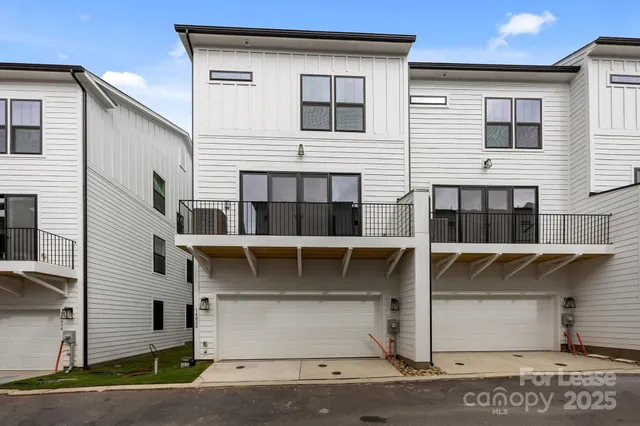 a view of a house with large windows