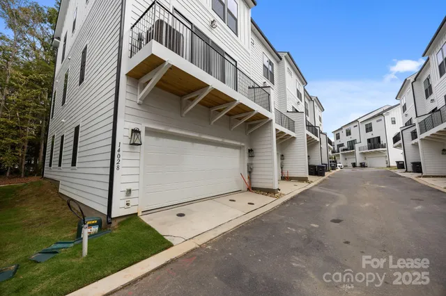 a front view of a house with garage