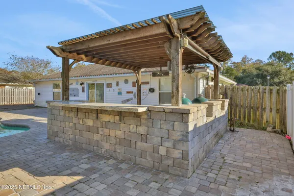 front view of a house with a wooden deck