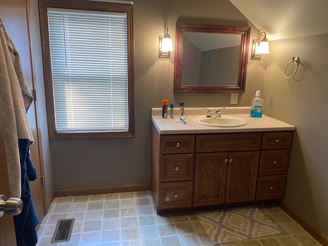 321 West 3rd Street Spring Valley, IL 61362 - Photo 11 of 14 a bathroom with a sink a vanity and a mirror