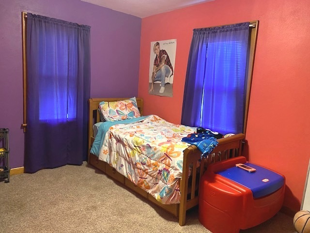 321 West 3rd Street Spring Valley, IL 61362 - Photo 9 of 14 a bedroom with a bed and teddy bear on bed