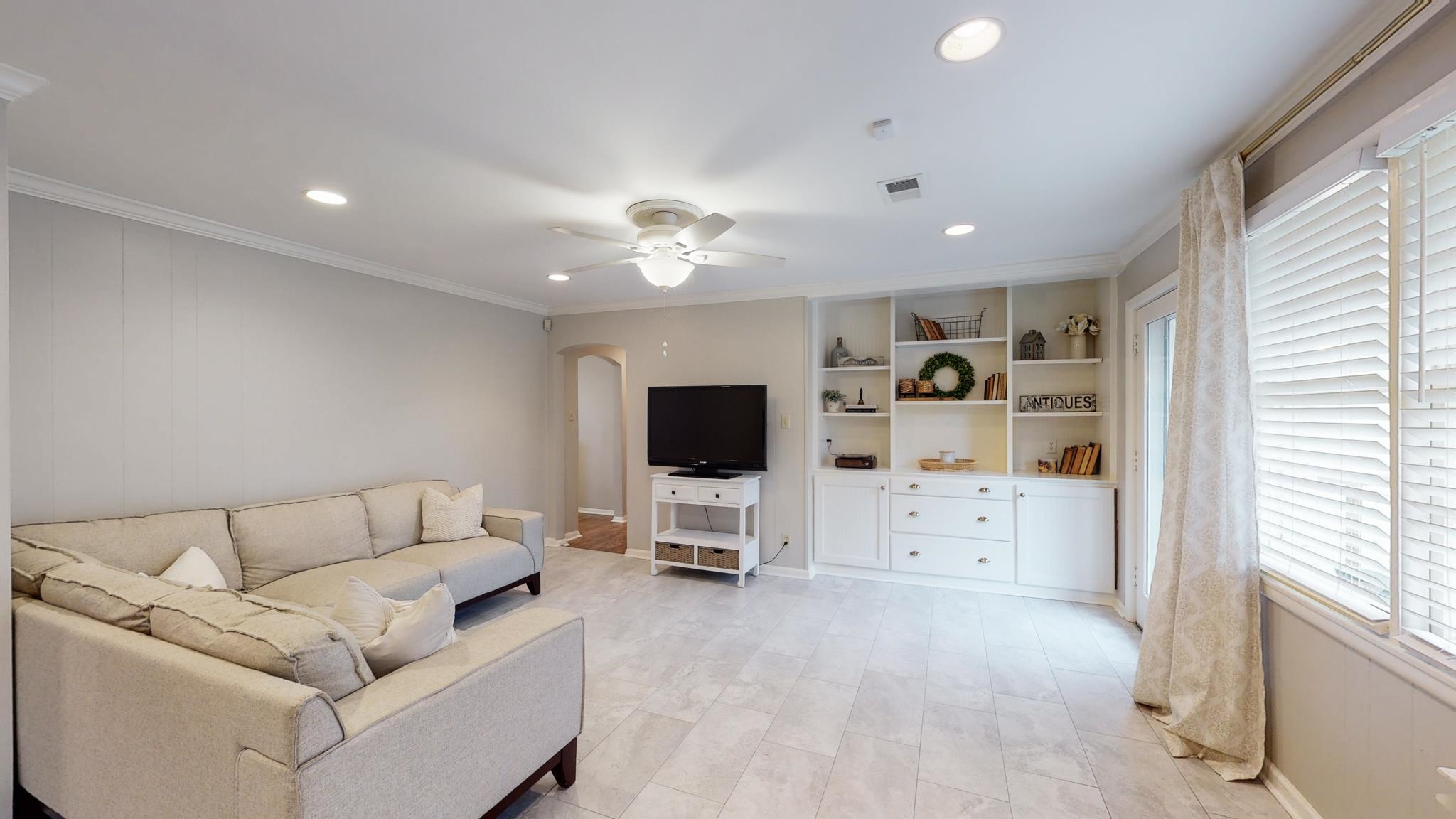 5531 Barfield Road Memphis, TN 38120 - Photo 3 of 25 a living room with furniture and a flat screen tv
