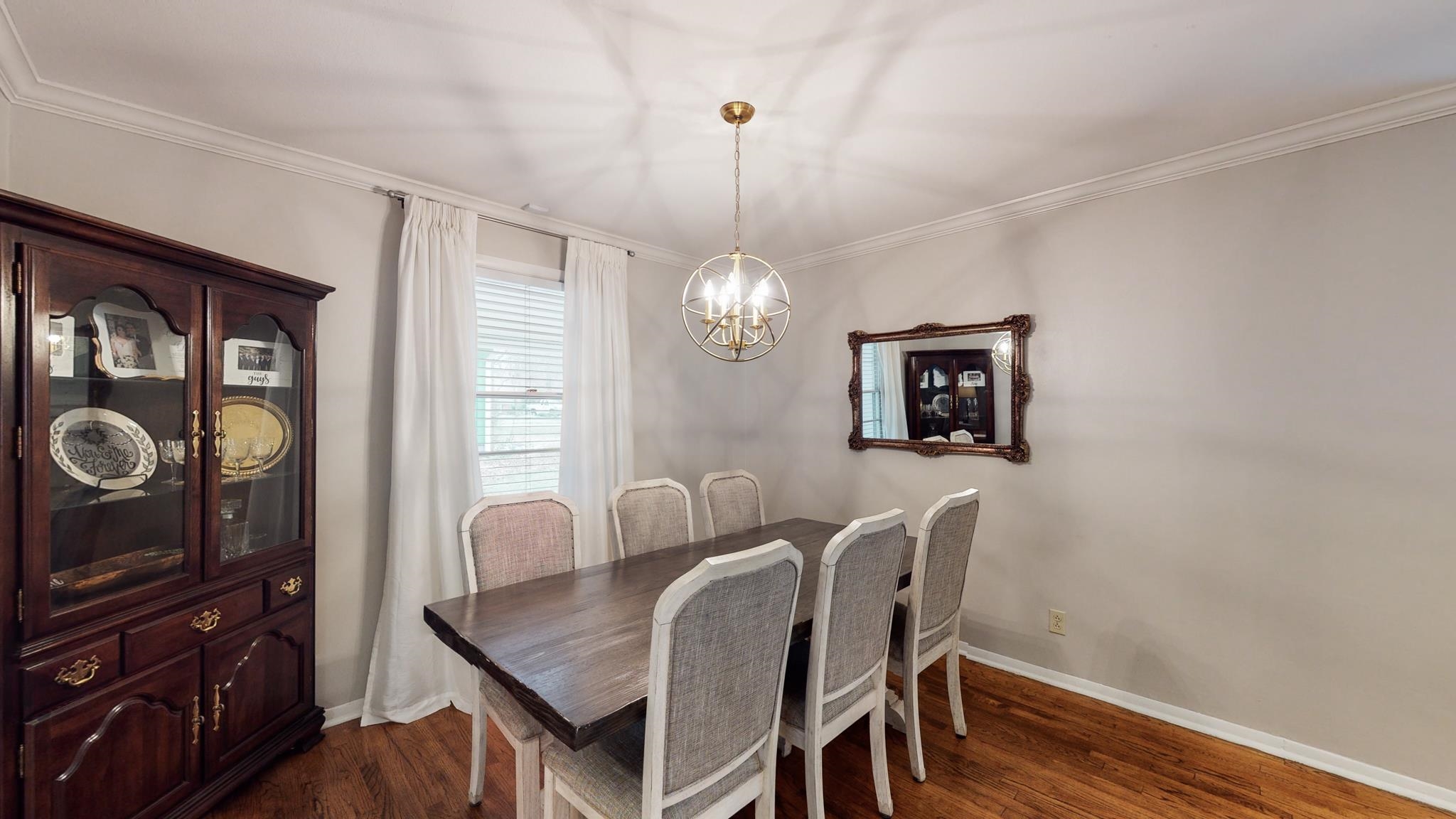 5531 Barfield Road Memphis, TN 38120 - Photo 5 of 25 a view of a dining room with furniture and wooden floor