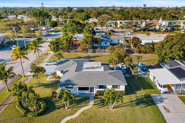 an aerial view of residential houses with outdoor space