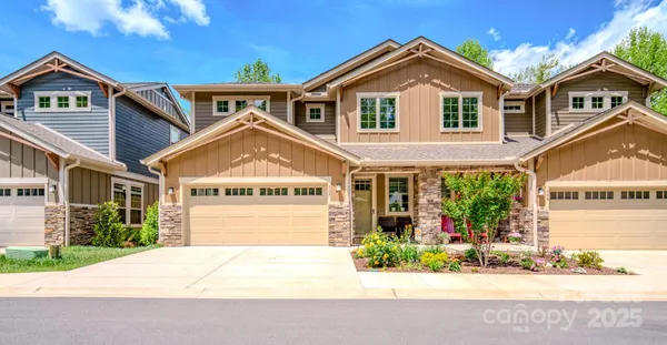 a view of a brick house with a large windows