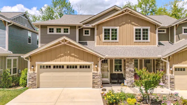 a front view of a house with a garden