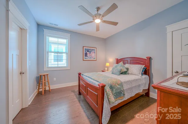 a bedroom with a bed and window