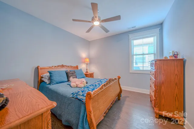 a bed room with a bed and a window