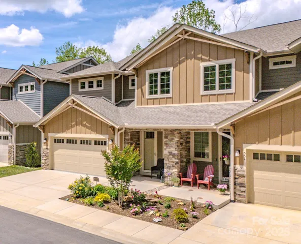 a front view of a building with sitting area