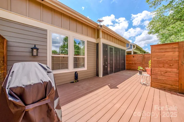 a view of a deck with wooden floor and furniture