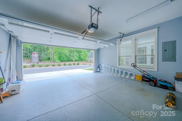 a view of a patio with a table and chairs under an umbrella