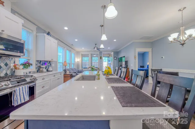 a view of a kitchen and dining area