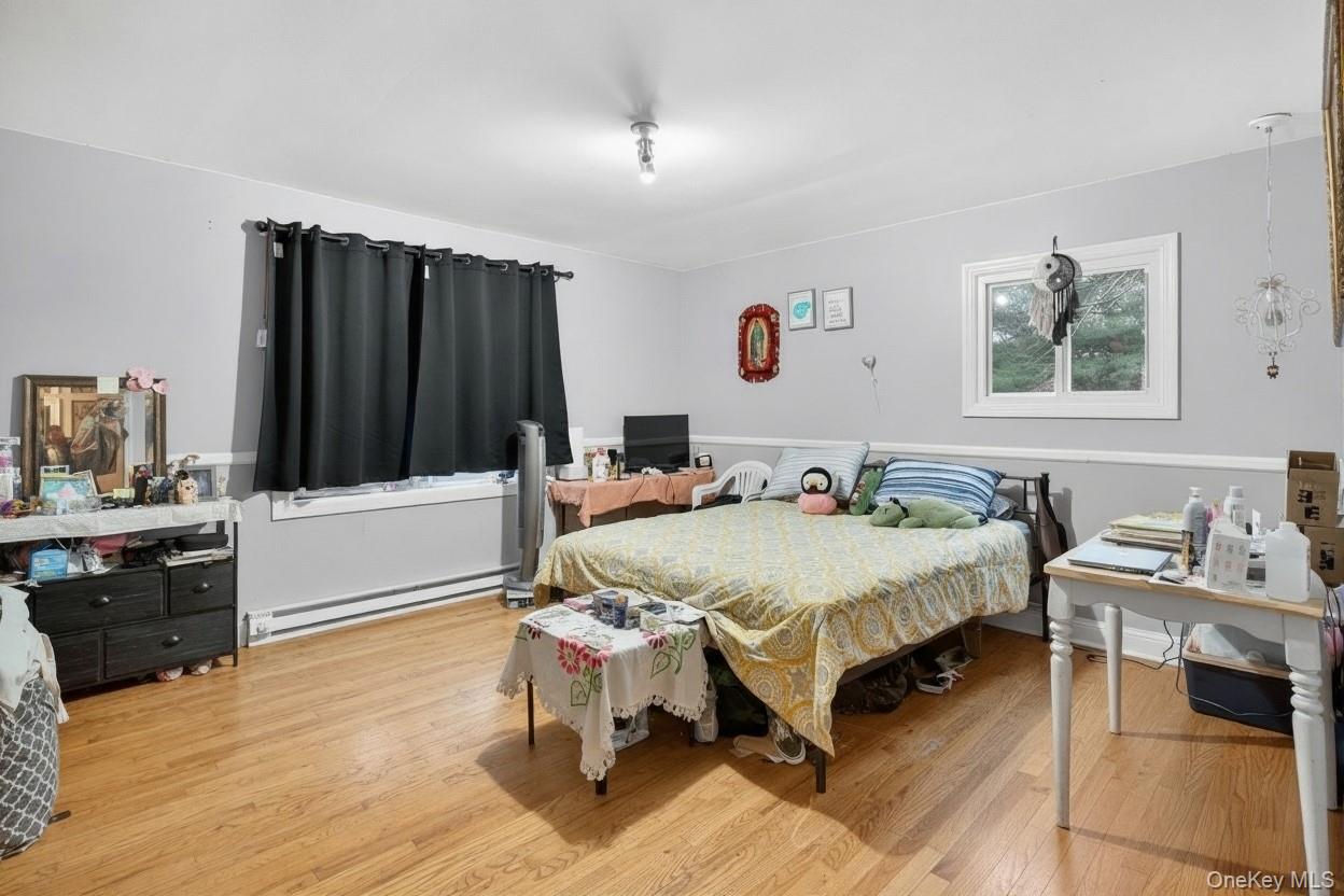 39 Peddler Hill Road Monroe, NY 10950 - Photo 12 of 30 a spacious bedroom with a bed and a table in it