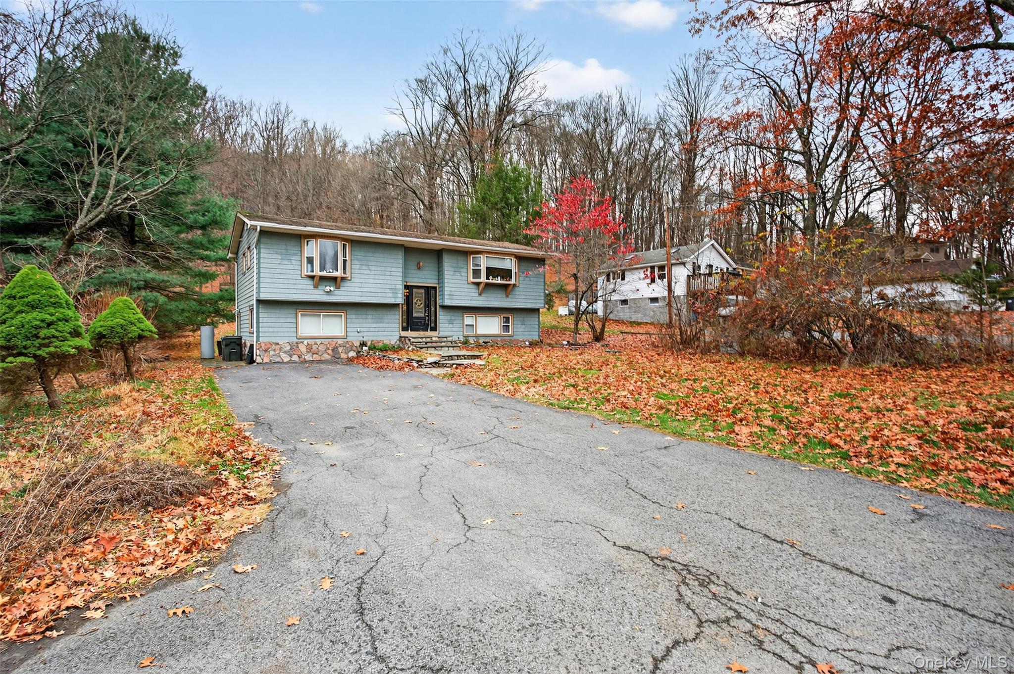 39 Peddler Hill Road Monroe, NY 10950 - Photo 2 of 30 a view of a house with a yard covered with snow in the outdoor space