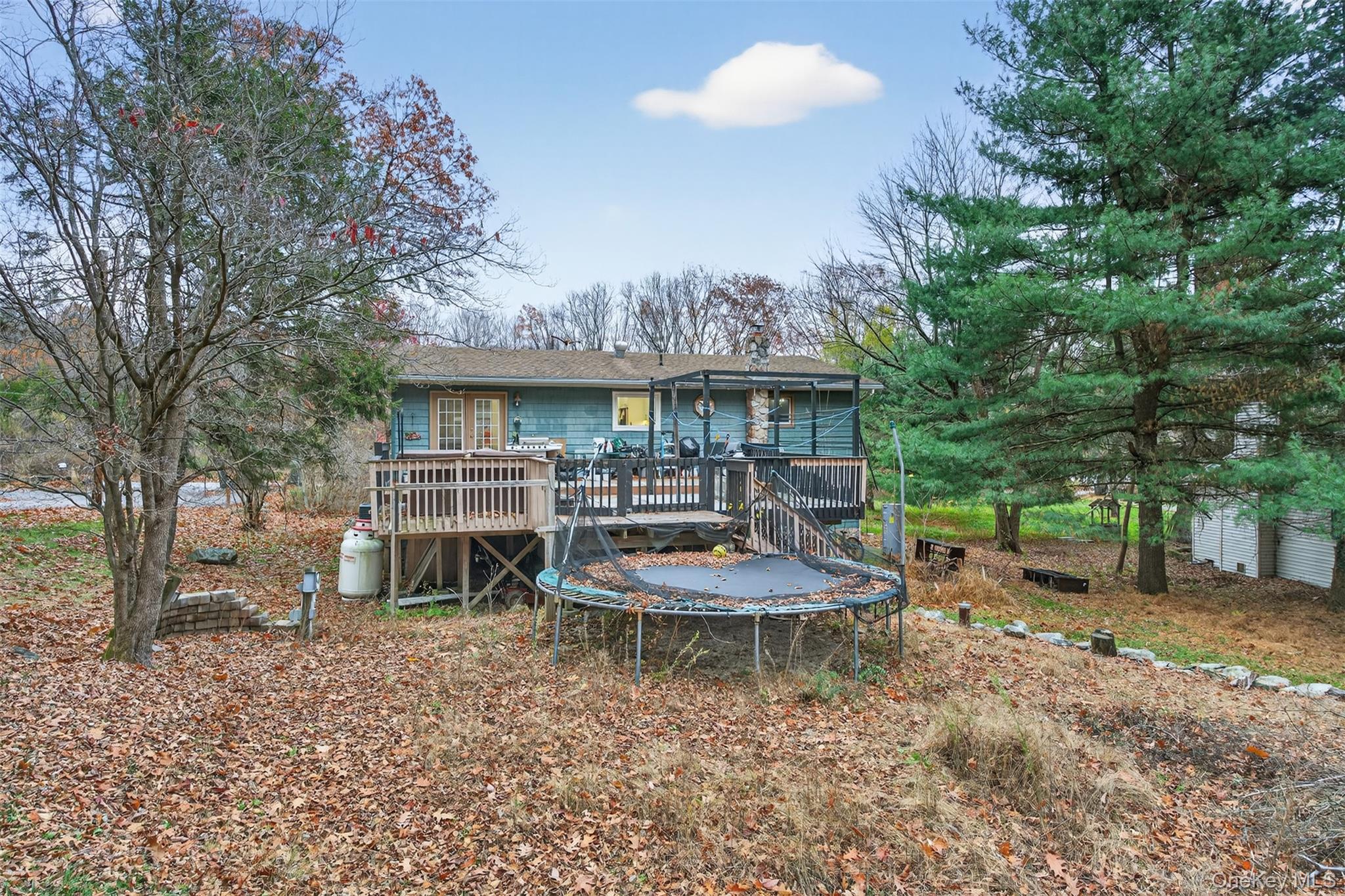 39 Peddler Hill Road Monroe, NY 10950 - Photo 22 of 30 a view of a house with backyard porch and sitting area