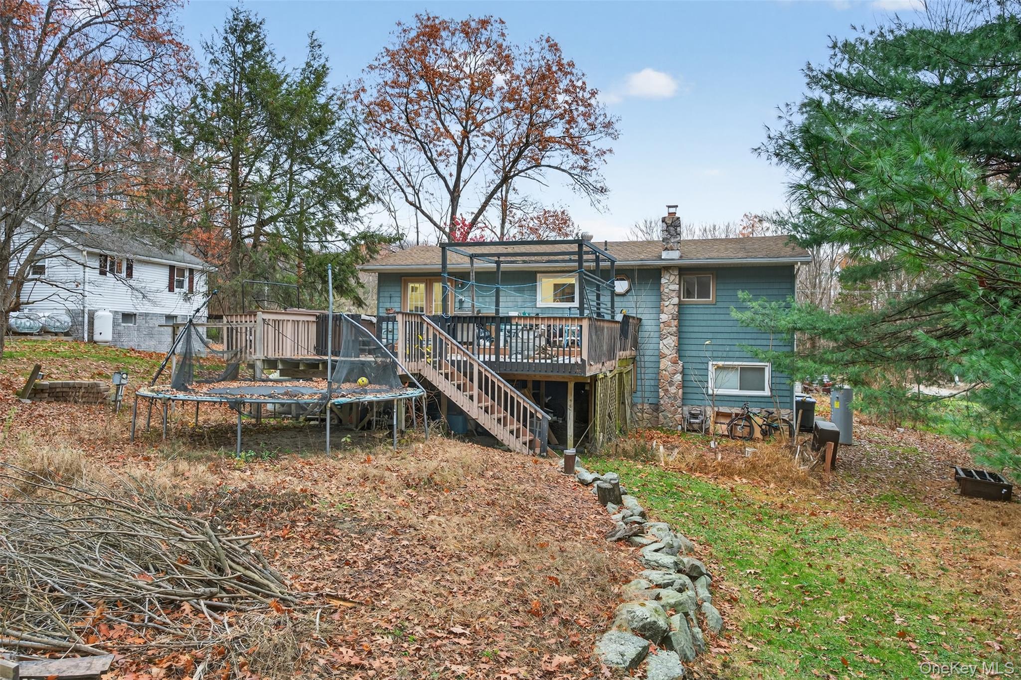 39 Peddler Hill Road Monroe, NY 10950 - Photo 23 of 30 a view of a house with a yard and sitting area