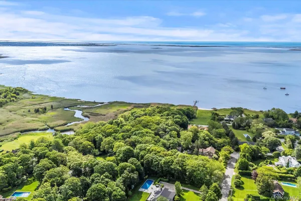 a view of a field with an ocean