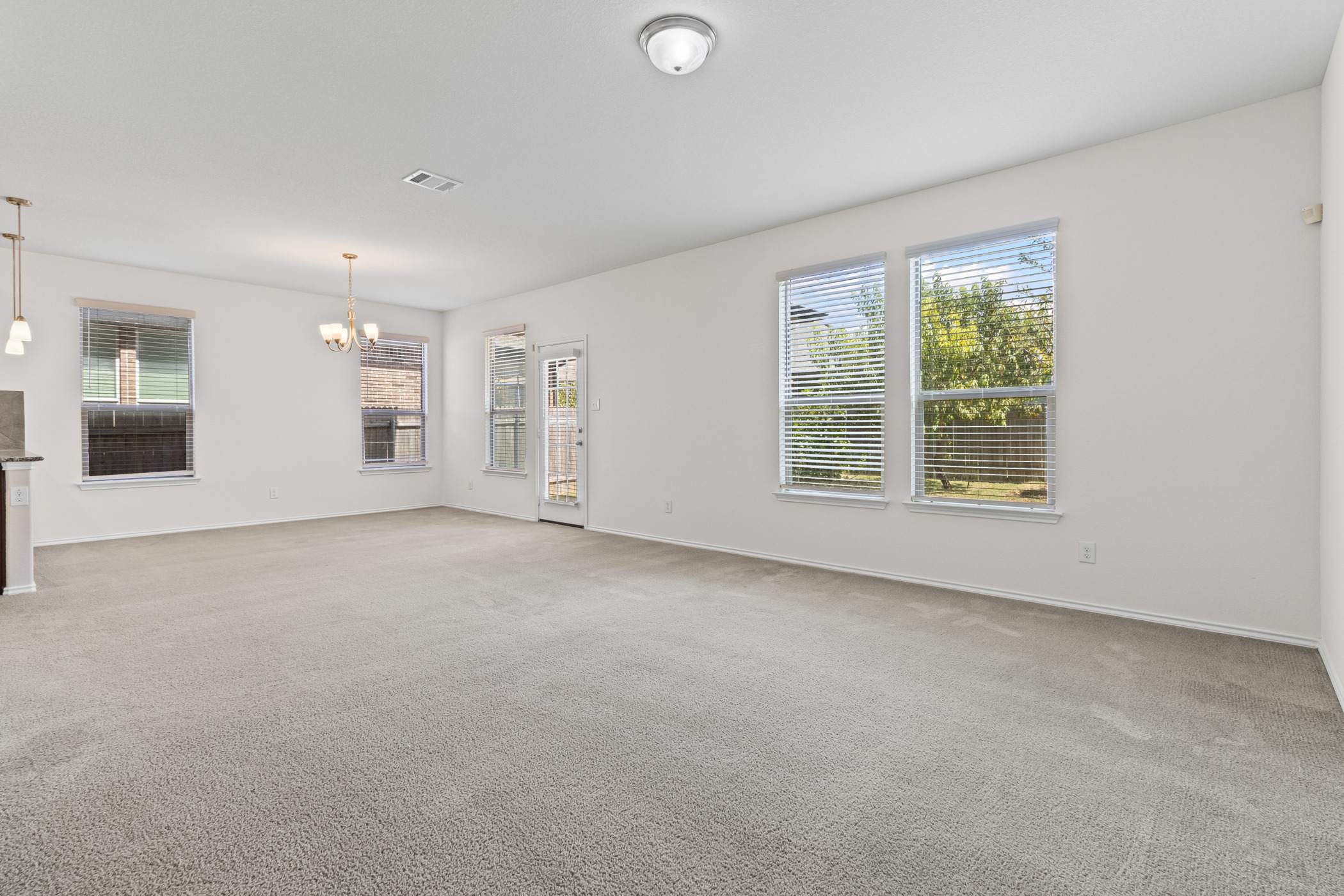 17015 Gibbons Path Round Rock, TX 78664 - Photo 5 of 29 an empty room with a empty space and windows