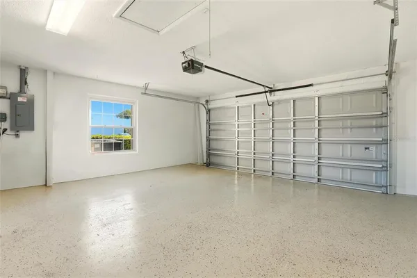 a view of a livingroom with an empty space and a window
