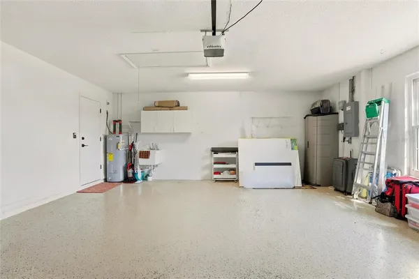 a view of a storage & utility room with two washing machine