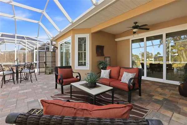 a outdoor living space with furniture and a rug