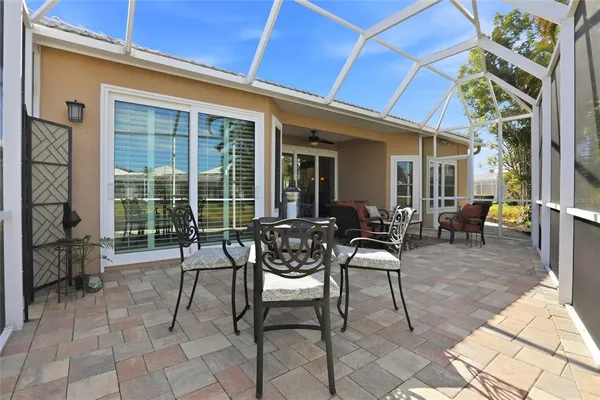 a patio with table and chairs