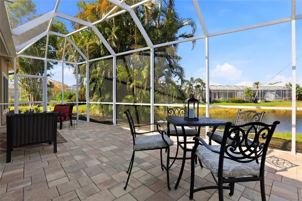 a view of a chairs and table in the patio