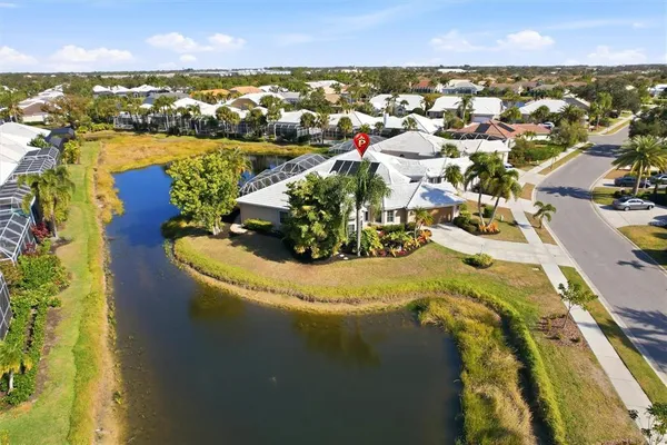 an aerial view of a house with a ocean view