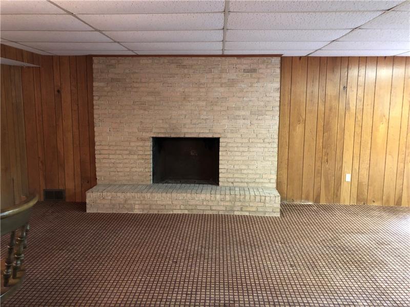 159 Hilton Road Greensburg, PA 15601 - Photo 13 of 22 Have fun in the finished lower level game room with fireplace & bar +++++ another full bathroom.