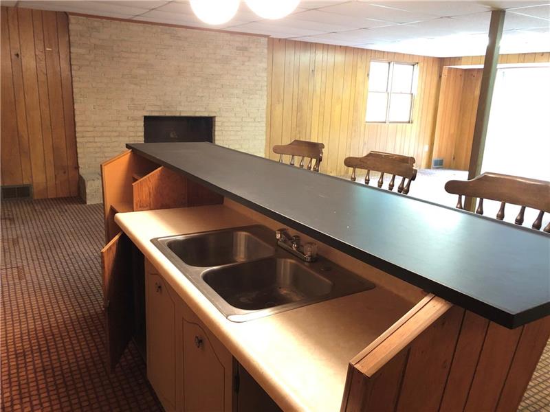 159 Hilton Road Greensburg, PA 15601 - Photo 14 of 22 Let the fun times roll.....lower level game room with wet bar and sliding glass doors to patio.