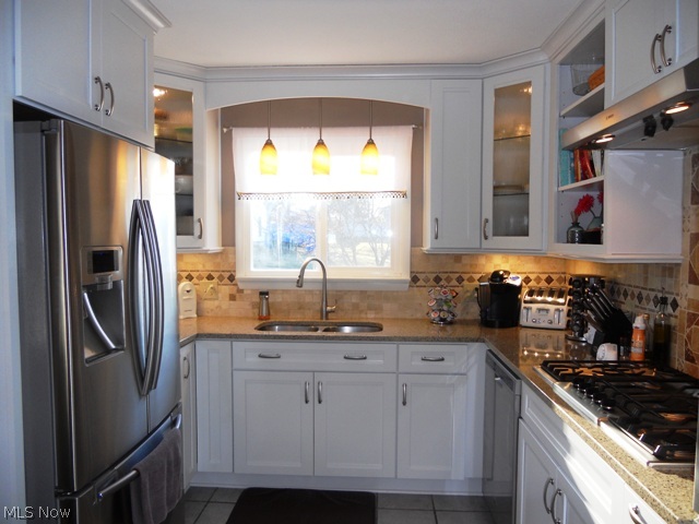 655 Bridge Road Akron, OH 44312 - Photo 8 of 25 Notice the in cabinet and under cabinet lighting, under mount stainless steel sink with high end faucet.