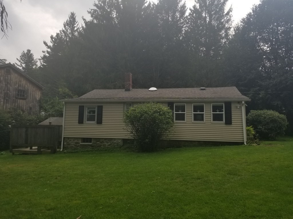 24 Pattison Avenue Dudley, MA 01571 - Photo 8 of 9 a view of a house with backyard and garden