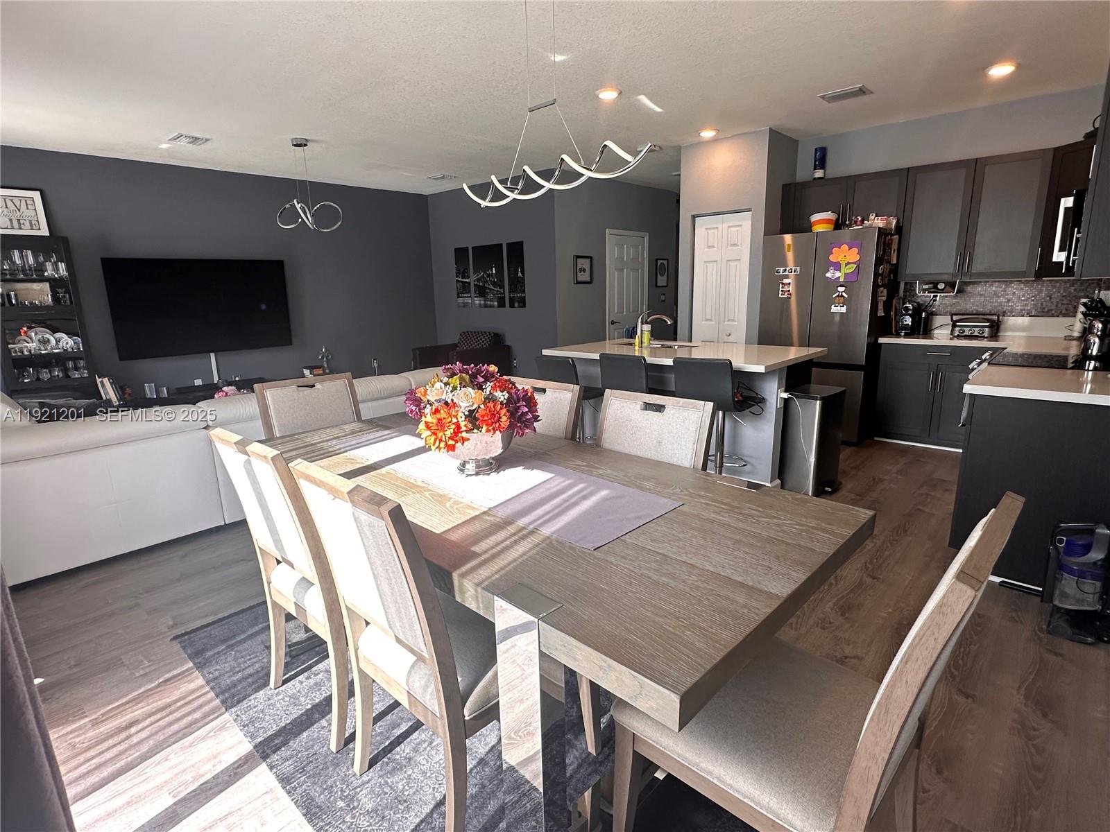 3378 West 100th Terrace, Unit 3378 Hialeah, FL 33018 - Photo 16 of 41 a view of a dining room with furniture