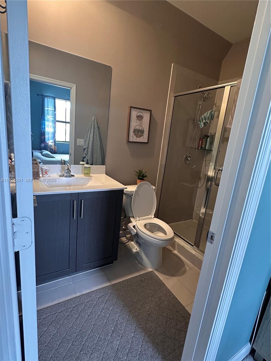 3378 West 100th Terrace, Unit 3378 Hialeah, FL 33018 - Photo 30 of 41 a bathroom with a sink and a mirror