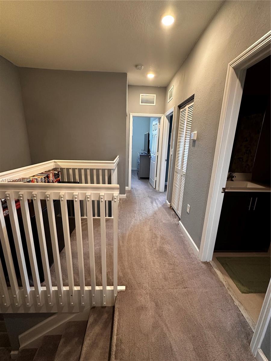 3378 West 100th Terrace, Unit 3378 Hialeah, FL 33018 - Photo 31 of 41 a view of a hallway with staircase