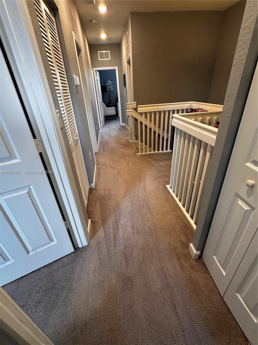 3378 West 100th Terrace, Unit 3378 Hialeah, FL 33018 - Photo 32 of 41 a view of a hallway with staircase