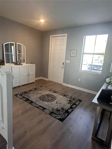 a bedroom with bed and a window