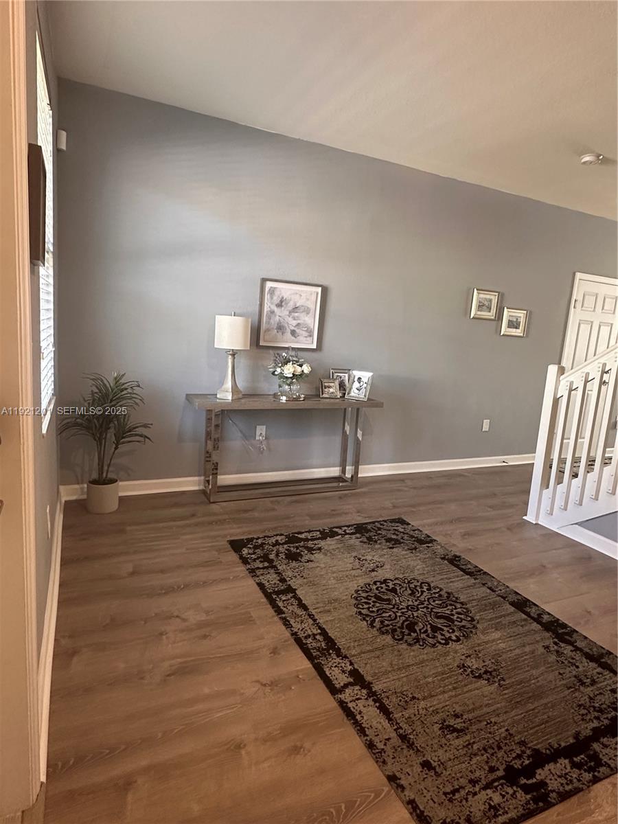 3378 West 100th Terrace, Unit 3378 Hialeah, FL 33018 - Photo 5 of 41 a living room with a rug