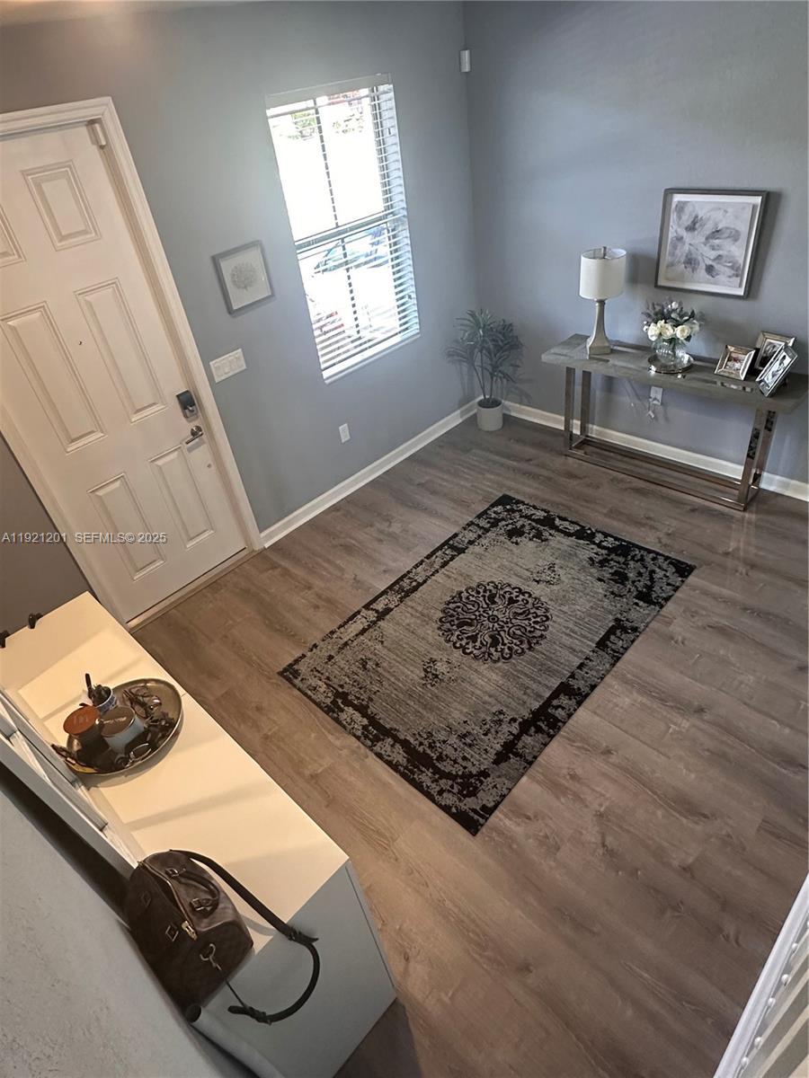 3378 West 100th Terrace, Unit 3378 Hialeah, FL 33018 - Photo 6 of 41 a living room with couch and a rug