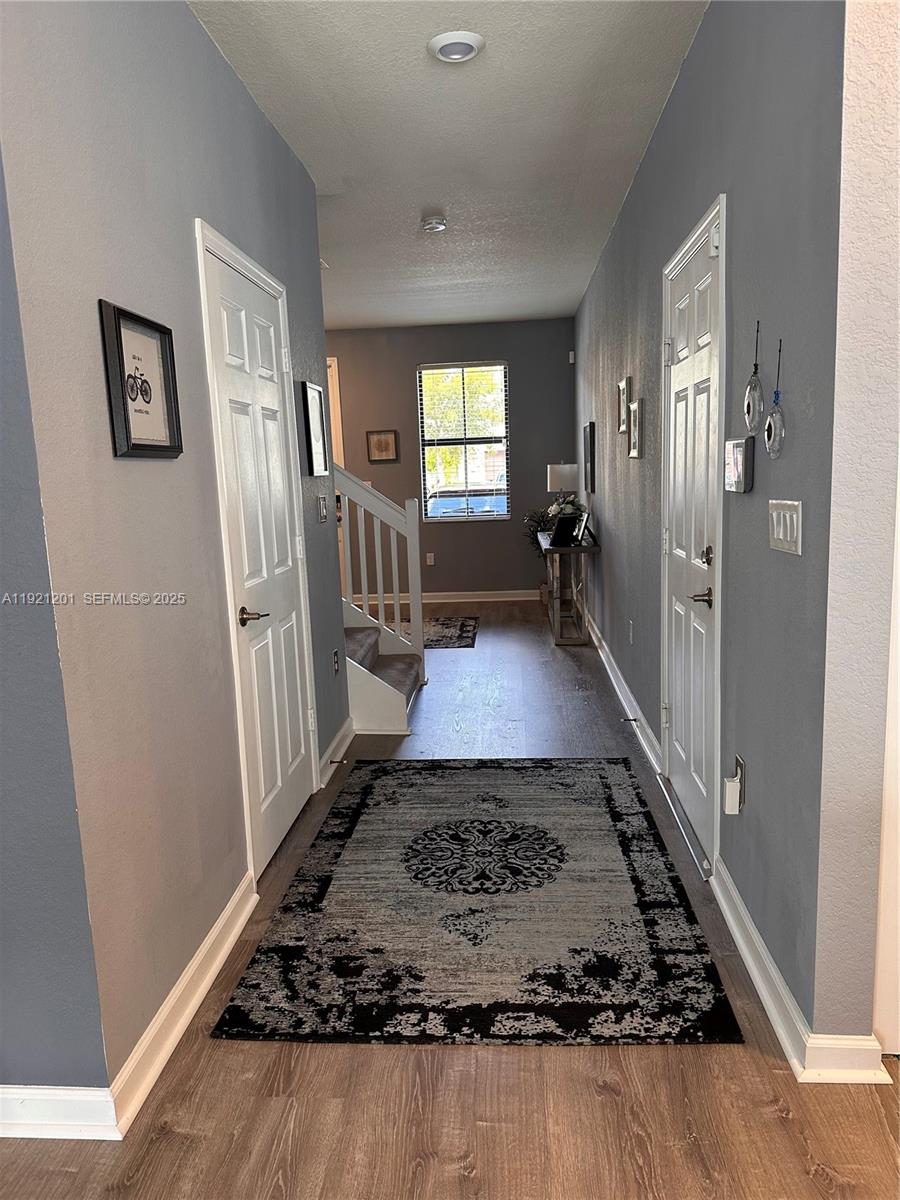 3378 West 100th Terrace, Unit 3378 Hialeah, FL 33018 - Photo 8 of 41 a view of a hallway view with staircase and a stove