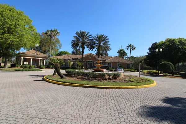 a swimming pool with outdoor seating and yard