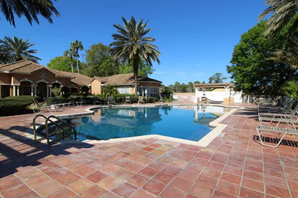 a view of a swimming pool with a table and chairs