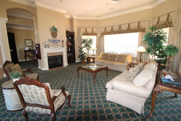 a room with pool table and windows