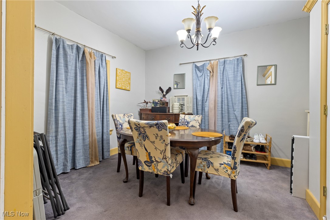 4512 Grayton Road Cleveland, OH 44135 - Photo 6 of 26 Carpeted dining space featuring a chandelier