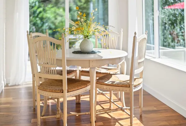 a dining room with furniture and wooden floor