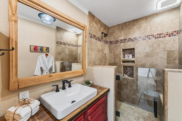 a bathroom with a sink and a mirror