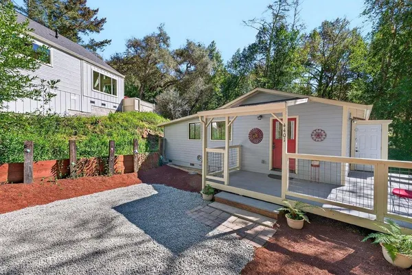 a front view of a house with a yard